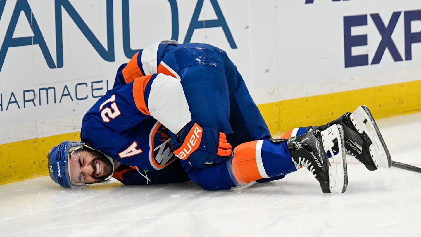 Nov 28, 2025; Elmont, New York, USA; New York Islanders center Kyle Palmieri (21) falls to the ice after an injury against the Philadelphia Flyers during the second period at UBS Arena. Mandatory Credit: Dennis Schneidler-Imagn Images