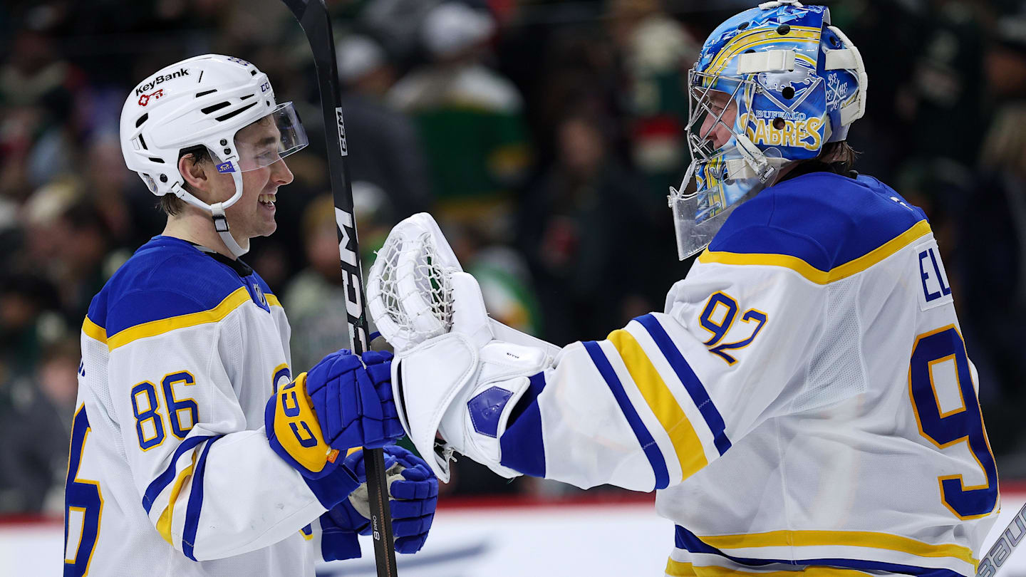 Nov 29, 2025; Saint Paul, Minnesota, USA; Buffalo Sabres center Noah Ostlund (86) and goaltender Colten Ellis (92) celebrate their shootout win against the Minnesota Wild at Grand Casino Arena. Mandatory Credit: Matt Krohn-Imagn Images