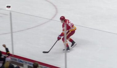 Wolf makes 16 saves for his 1st shutout of the season in Flames' 2-0 win over Sharks