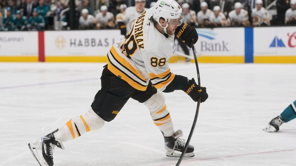 Boston Bruins right wing David Pastrnak (88) shoots the puck against the San Jose Sharks during the second period of an NHL hockey game in San Jose, Calif., Sunday, Nov. 23, 2025. (AP Photo/Jeff Chiu)