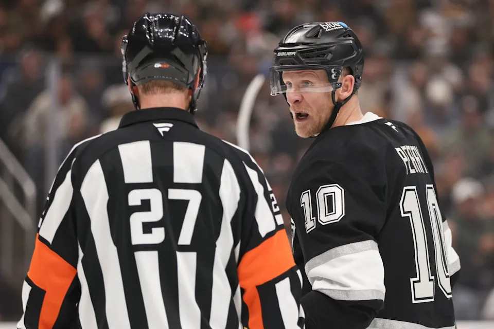 Right wing Corey Perry #10 of the Los Angeles Kings has a discussion with referee Eric Furlatt during an NHL hockey game against the Boston Bruins, Friday November 21, 2025 in Los Angeles, Calif.