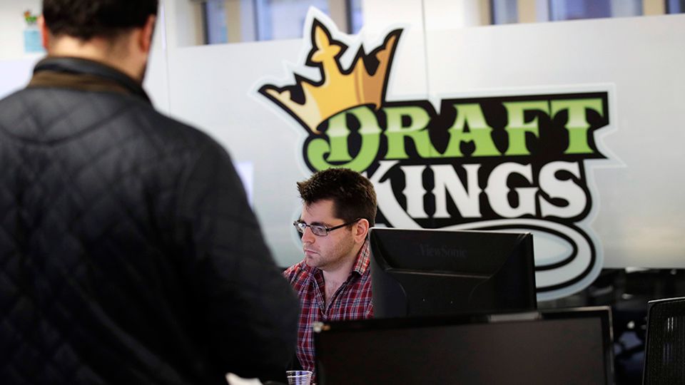 In this Thursday, Jan. 11, 2018 photo, employees work at the DraftKings office in Boston. (AP Photo/Charles Krupa)