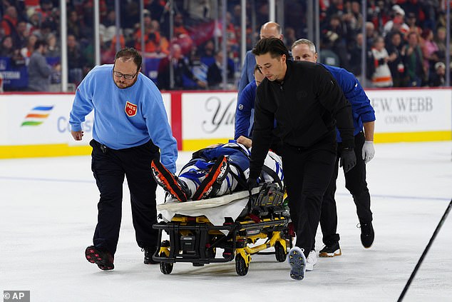 He was soon lifted on to a stretcher and put in a neck brace before being taken off the ice
