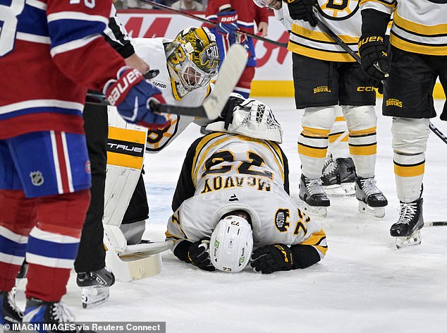 McAvoy immediately covered his face and dropped to the ice in apparent agony