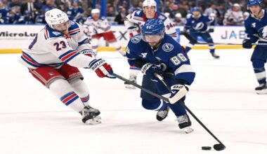 Tampa Bay Lightning right wing Nikita Kucherov (86) handles the puck against New York Rangers defenseman Adam Fox (23) during the second period of an NHL hockey game Wednesday, Nov. 12, 2025, in Tampa, Fla. (AP Photo/Jason Behnken)