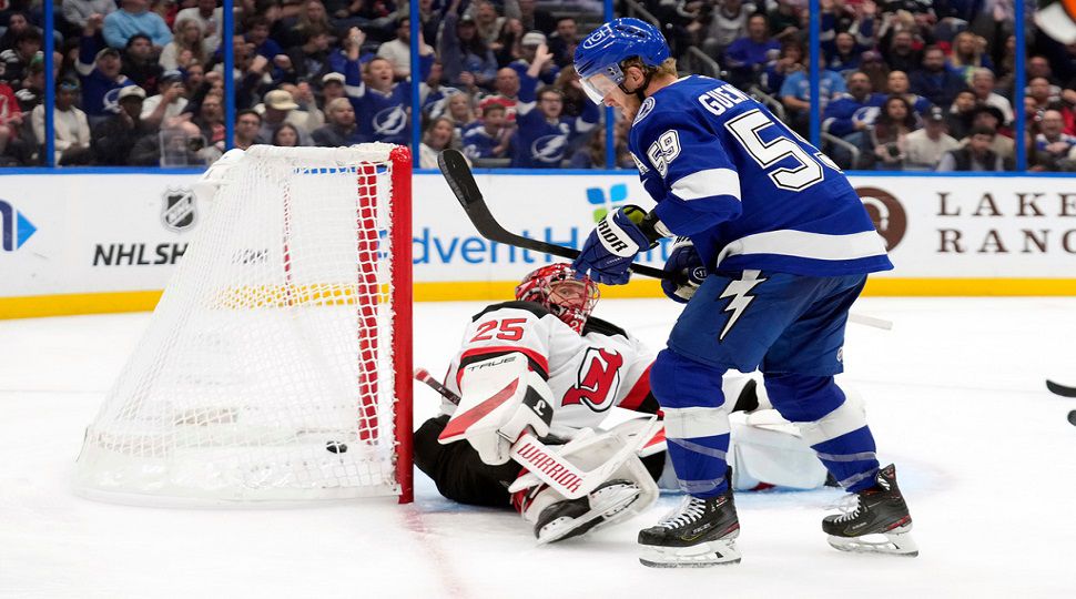 Tampa Bay Lightning center Jake Guentzel (59) scores past New Jersey Devils goaltender Jacob Markstrom (25) during the second period of an NHL hockey game Tuesday, Nov. 18, 2025, in Tampa, Fla. (AP Photo/Chris O'Meara)