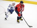 Washington Capitals left winger Alex Ovechkin skates with the puck past Toronto Maple Leafs' Matthew Knies during a game last year.