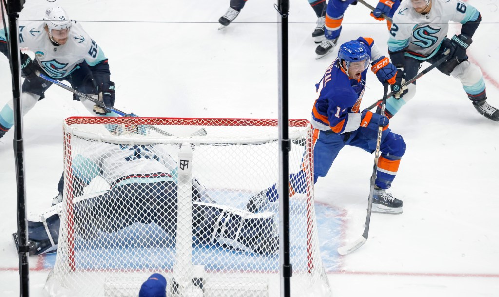 Mathew Barzal of the New York Islanders taking a shot on goal.