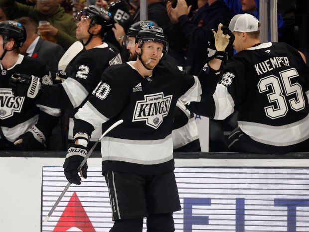Kings forward Corey Perry celebrates his goal as he skates...