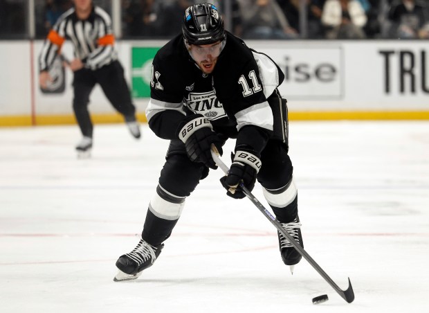 Kings captain Anze Kopitar skates with the puck during the...
