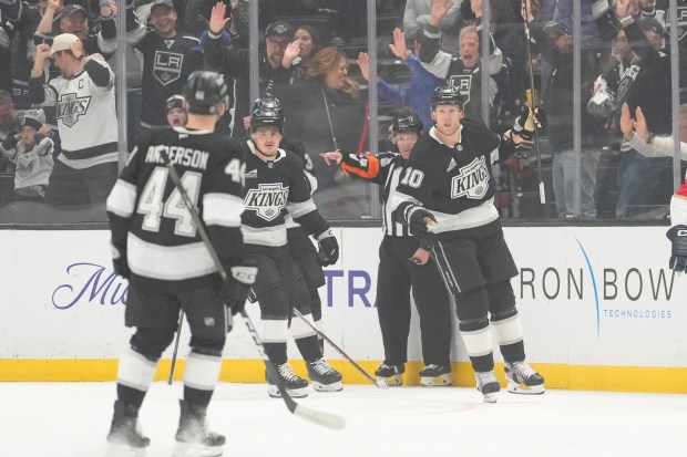 Kings right wing Corey Perry, right, celebrates his goal with...