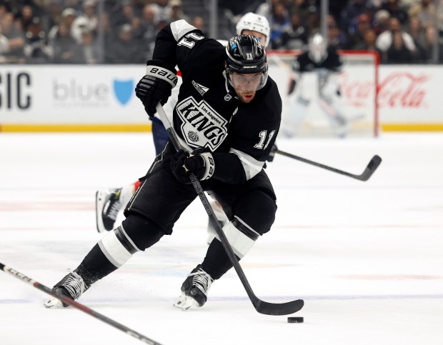 Kings captain Anze Kopitar skates with the puck during the...