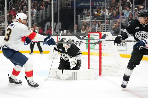 Florida Panthers defenseman Seth Jones, left, and Kings defenseman Cody...
