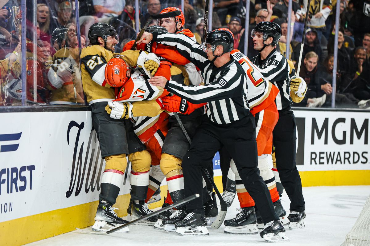 Vegas Golden Knights D Shea Theodore (27) and Anaheim Ducks RW Frank Vatrano (77) incite a scrum during an NHL game on Saturday November 8, 2025, in Las Vegas, Nevada.  
