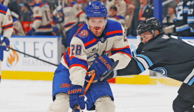 Edmonton Oilers forward Jack Roslovic (28) carries the puck around Utah Mammoth defensemen Olli Maatta (2) during the first period at Rogers Place.