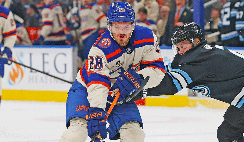 Edmonton Oilers forward Jack Roslovic (28) carries the puck around Utah Mammoth defensemen Olli Maatta (2) during the first period at Rogers Place.
