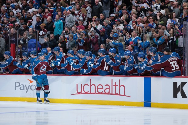 The Colorado Avalanche’s Artturi Lehkonen celebrates with teammates on the...