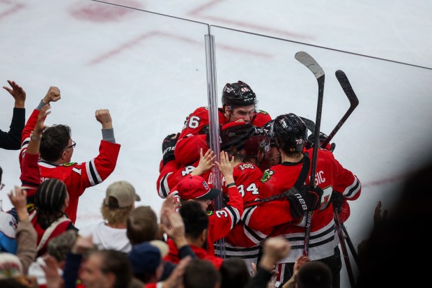 Chicago Blackhawks players celebrate after Chicago Blackhawks center Colton Dach (34) scored a goal during the third period against the Toronto Maple Leafs at the United Center Saturday Nov. 15, 2025 in Chicago. (Armando L. Sanchez/Chicago Tribune)