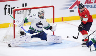 Vancouver Canucks goaltender Jiri Patera, left, fails to stop a shot by Florida Panthers defenseman Seth Jones (not shown) for the team