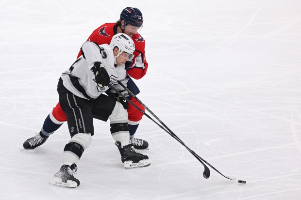 The Kings’ Kevin Fiala, left, and the Washington Capitals’ Brandon...