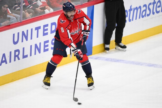 Washington Capitals left wing Alex Ovechkin passes the puck during...