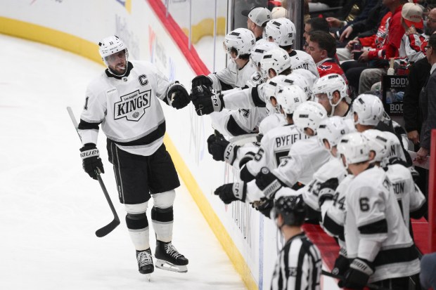 Kings center Anze Kopitar celebrates at the bench after scoring...