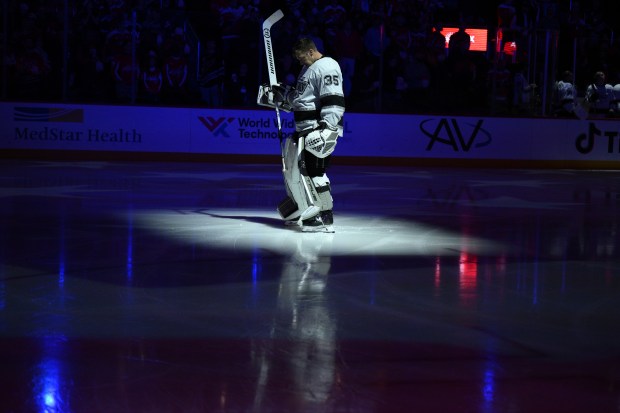 Kings goaltender Darcy Kuemper stands on the ice before a...