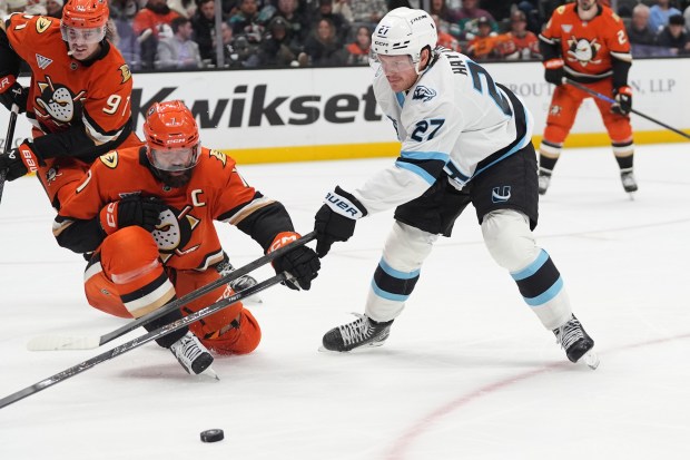 Ducks defenseman Radko Gudas, front left, blocks a shot by...
