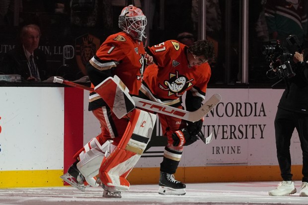 Ducks defenseman Olen Zellweger, right, celebrates his game-winning overtime goal...