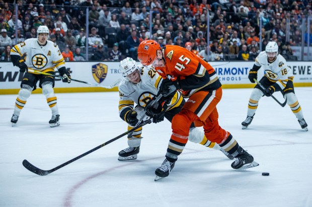 Ducks right wing Beckett Sennecke (45) and Boston Bruins defenseman...