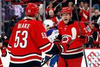 Carolina Hurricanes' Nikolaj Ehlers (27) celebrates his goal with Jackson Blake (53) during the second period of an NHL hockey game against the Edmonton Oilers in Raleigh, N.C., Saturday, Nov. 15, 2025. 