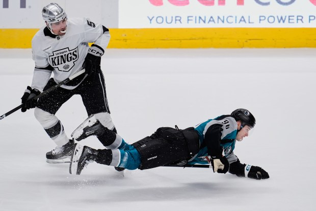 San Jose Sharks center Philipp Kurashev falls on the ice...