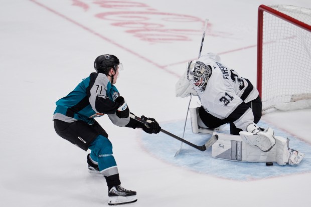 San Jose Sharks center Macklin Celebrini, left, is unable to...