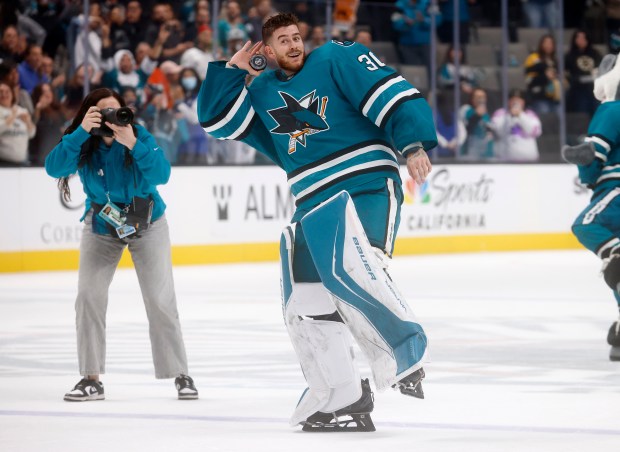 San Jose Sharks goaltender Yaroslav Askarov (30) skates onto the...