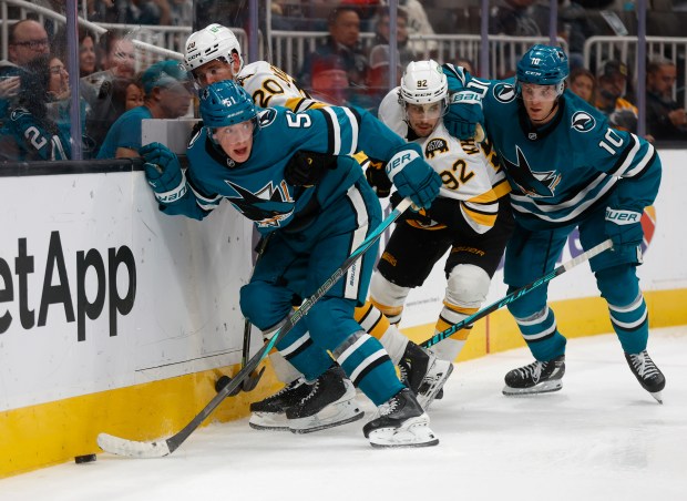 San Jose Sharks’ Collin Graf (51) fights for the puck...