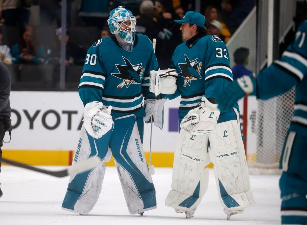 San Jose Sharks goaltender Yaroslav Askarov (30) and San Jose...