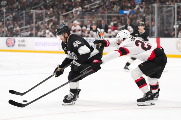 Ottawa Senators center Dylan Cozens, right, pressures Kings right wing...