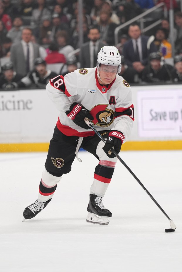 Ottawa Senators center Tim Stützle moves the puck during the...