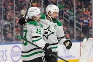 Dallas Stars' Sam Steel (18) and Jamie Benn (14) celebrate a goal against the Edmonton...