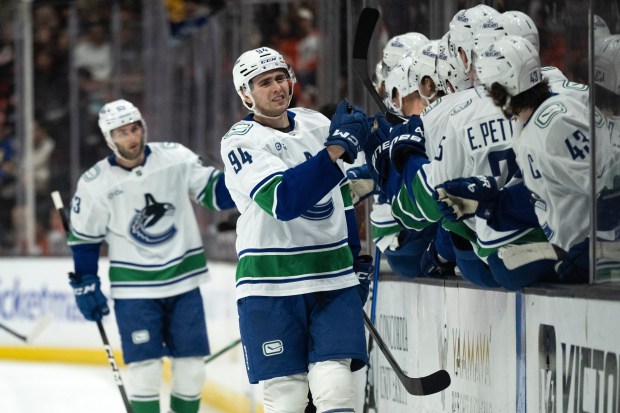 Vancouver Canucks center Linus Karlsson (94) celebrates his goal with...
