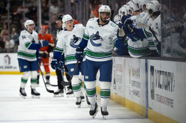 Vancouver Canucks left wing Evander Kane (91) celebrates his goal...