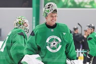 Dallas Stars goaltender Jake Oettinger shares a laugh while exiting the first round of a...