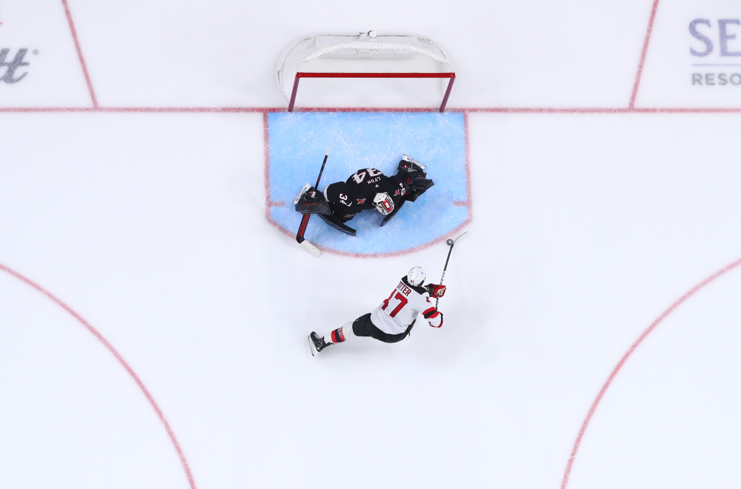 BUFFALO, NEW YORK - NOVEMBER 28: Paul Cotter #47 of the New Jersey Devils takes a shot on Alex Lyon #34 of the Buffalo Sabres during an NHL game on November 28, 2025 at KeyBank Center in Buffalo, New York. (Photo by Bill Wippert/NHLI via Getty Images)