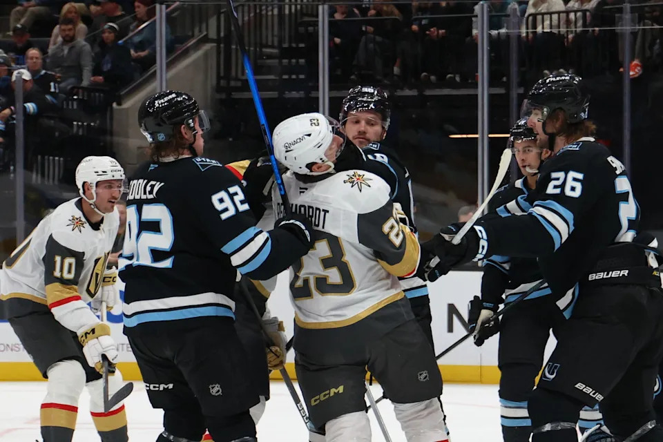 Nov 20, 2025; Salt Lake City, Utah, USA; Utah Mammoth defenseman Mikhail Sergachev (98) and Vegas Golden Knights left wing Cole Reinhardt (23) fight during the second period at Delta Center. (Rob Gray-Imagn Images).