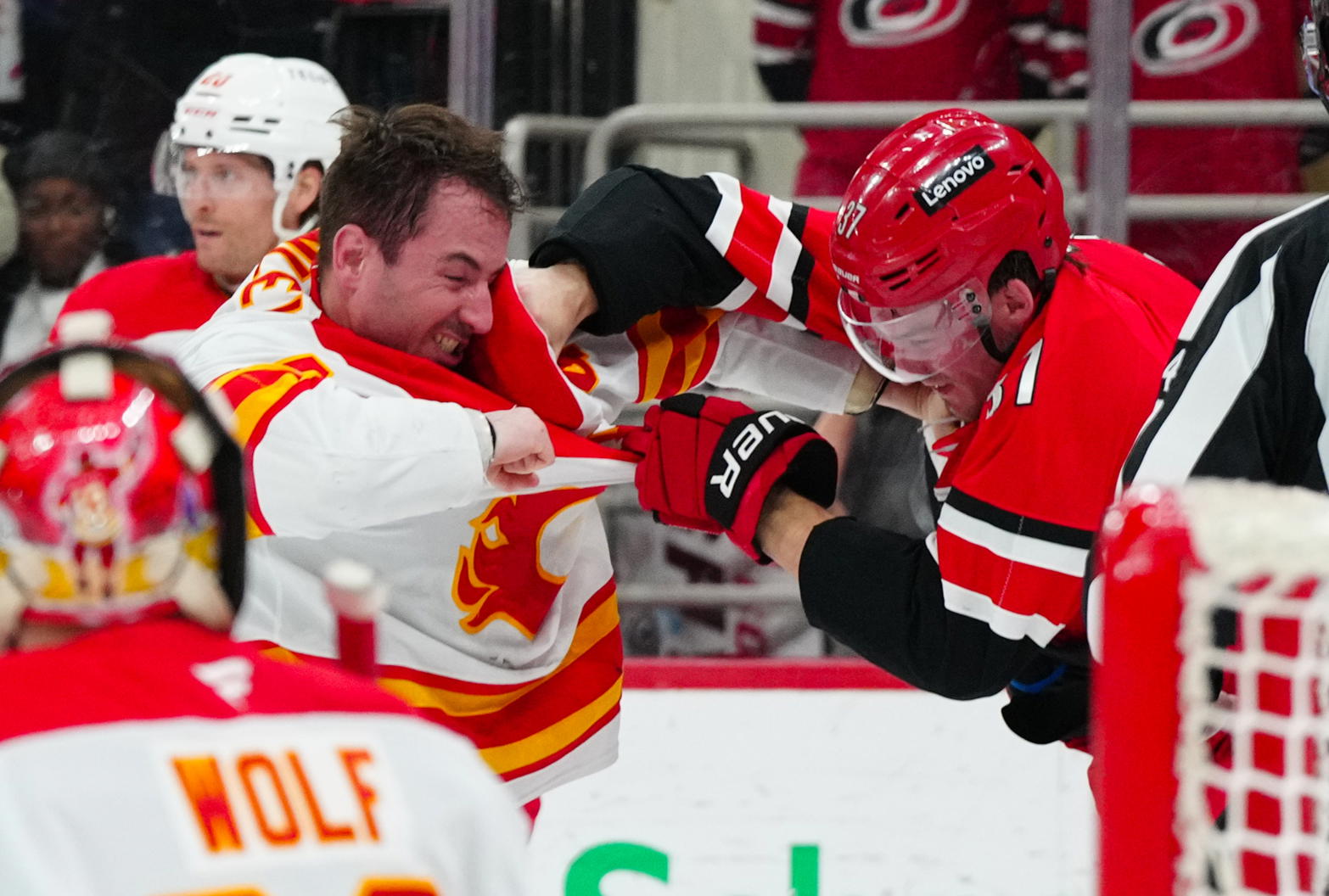 Calgary Flames defenceman Joel Hanley (44) and Carolina Hurricanes right wing Andrei Svechnikov (37) fight during their game at the Lenovo Center in Raleigh, North Carolina. (Source: James Guillory-Imagn Images)