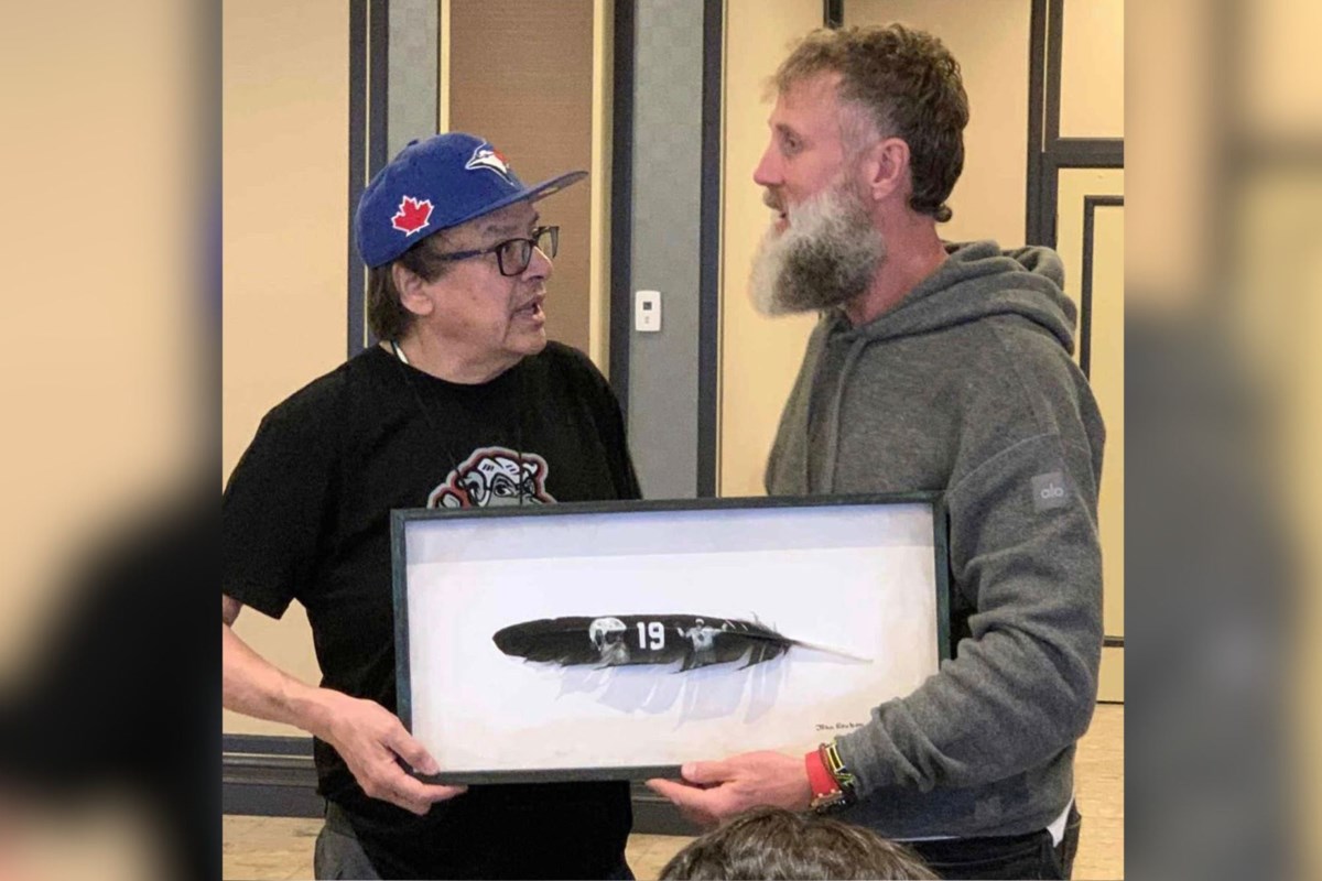 Northern artist's painted feather gifted to Hockey Hall of Famer