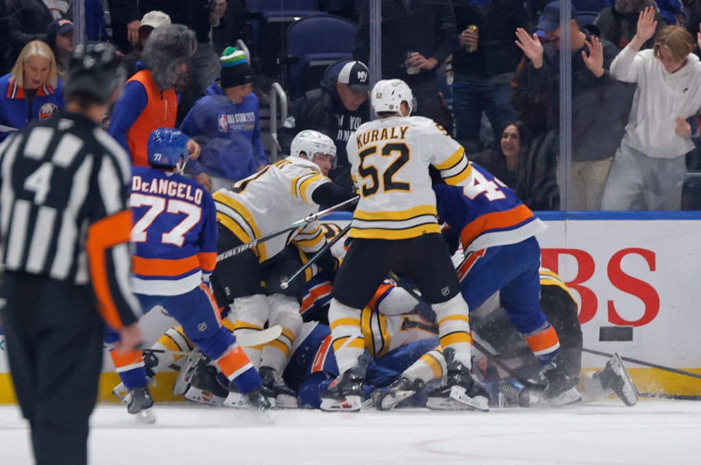 New York Islanders defenseman Matthew Schaefer (48) gets some attention and rough play that ended in a fight when his teammates came to his defense during the second period when the New York Islanders played the Boston Bruins Tuesday, November 4, 2025 at UBS Arena in Elmont, NY. 