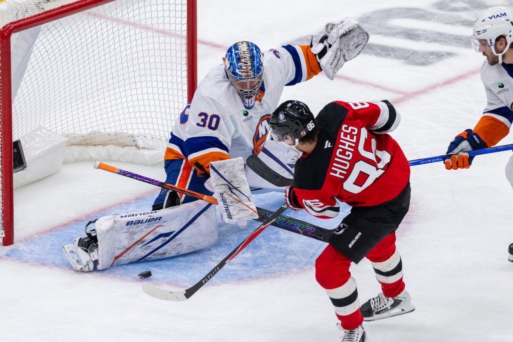 New York Islanders goaltender Ilya Sorokin (30) blocks New Jersey Devils center Jack Hughes (86) during the second period at the Prudential Center, Monday, Nov. 10, 2025, in Newark, NJ. 