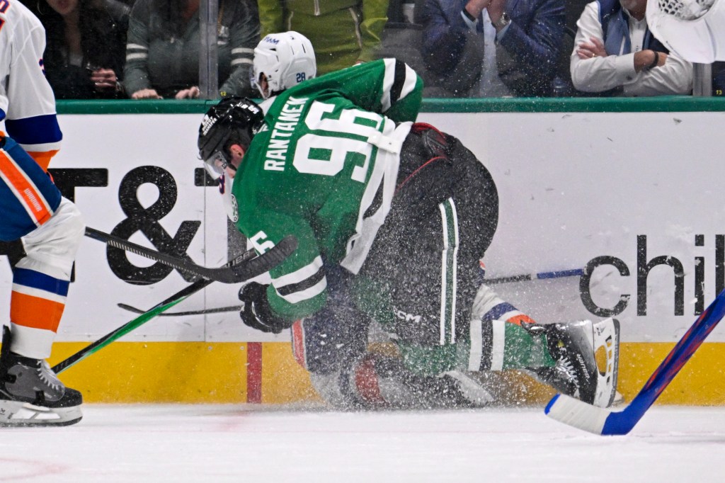 Dallas Stars right wing Mikko Rantanen (96) is called for a game misconduct penalty for boarding on New York Islanders defenseman Alexander Romanov (28) during the third period at the American Airlines Center.