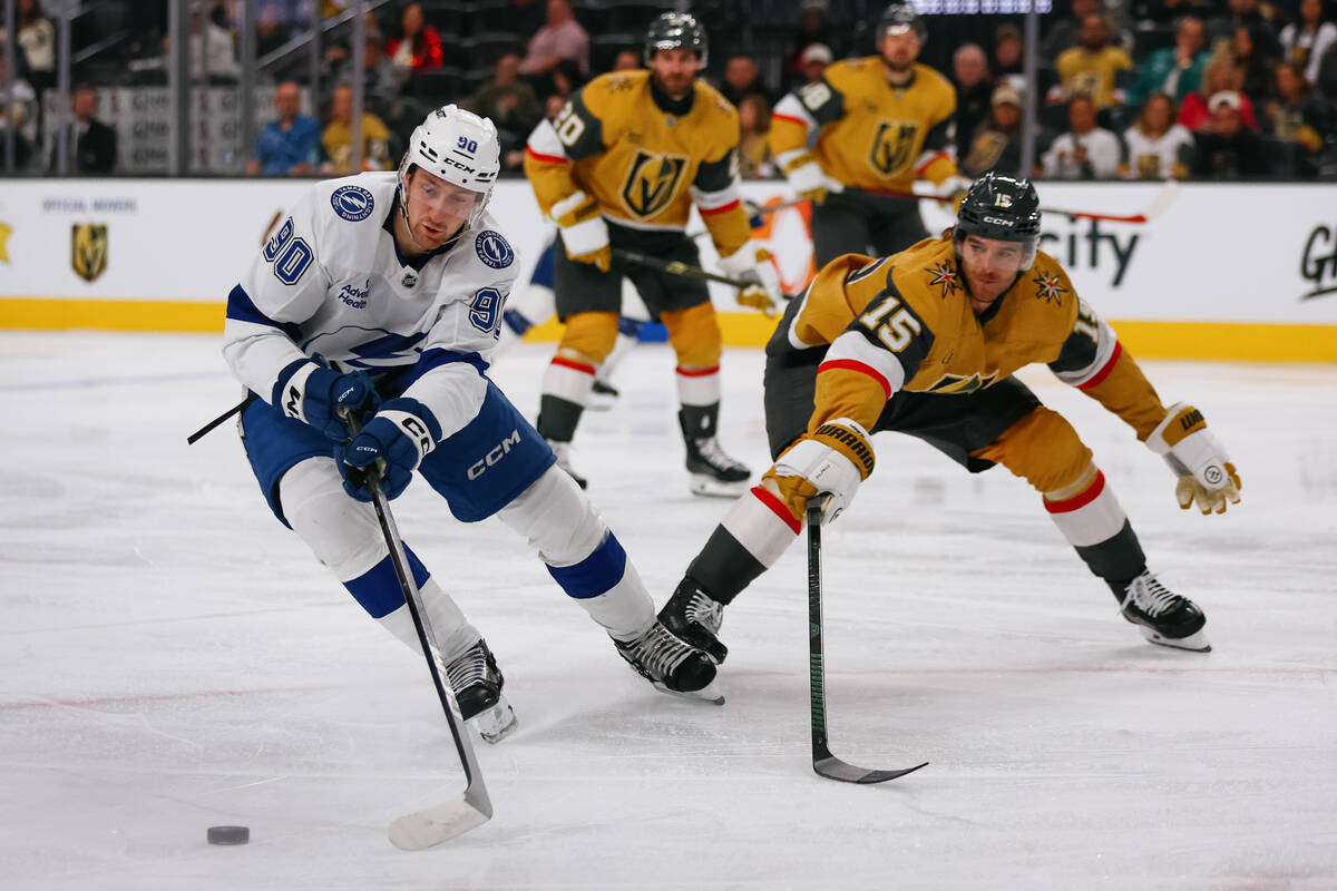 Tampa Bay Lightning defenseman J.J. Moser (90) skates with the puck as Golden Knights defensema ...